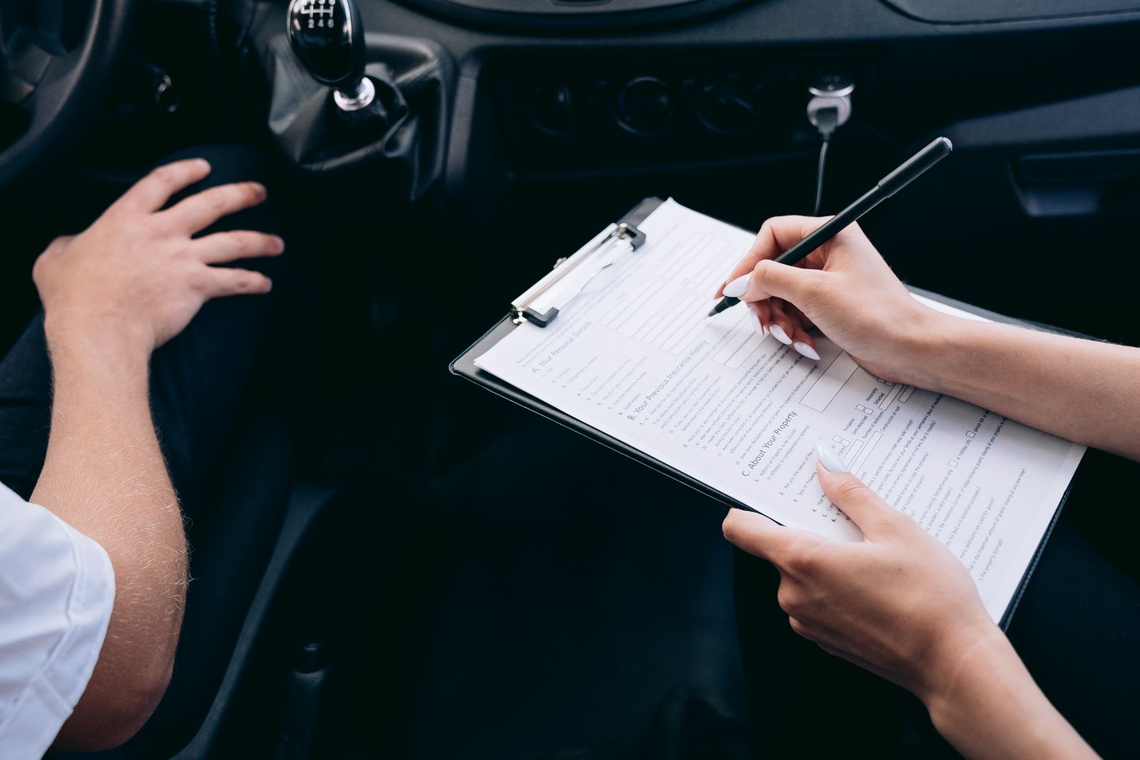 Vehicle service history recorded on an inspection checklist inside a car at All Car Care Centre
